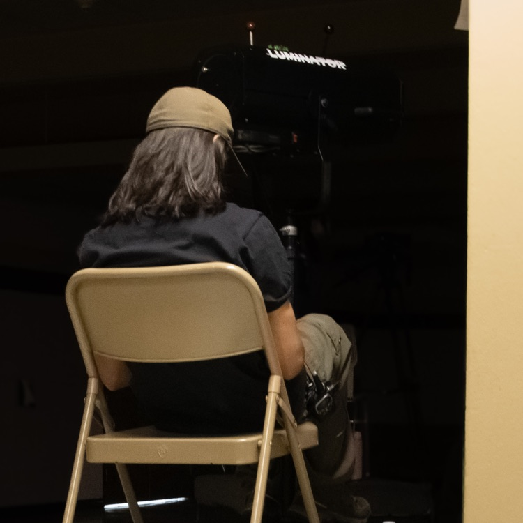 A man operating a stage light