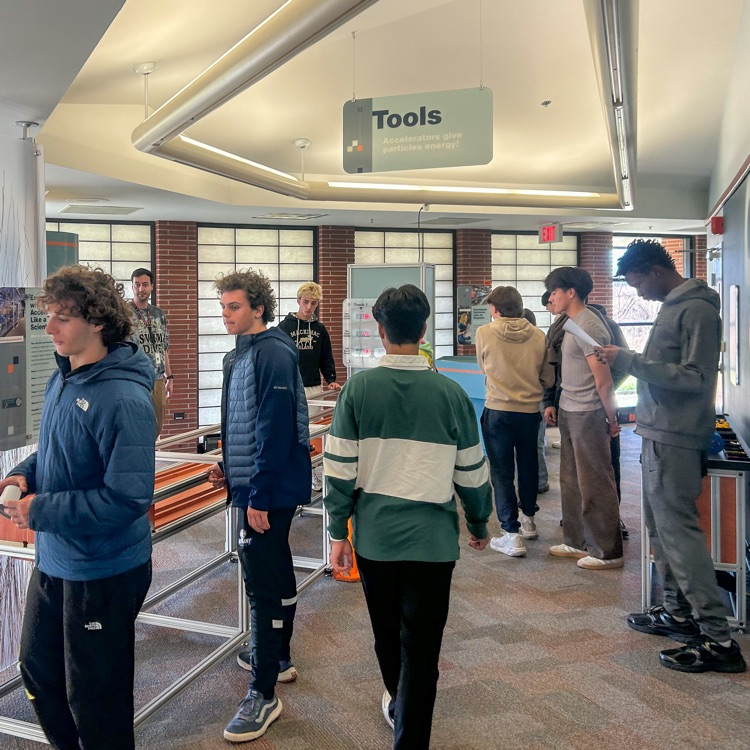 A group of highschool students standing around