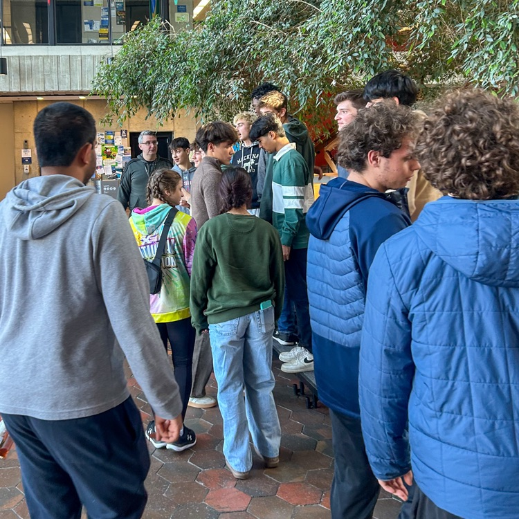 A group of highschool students standing around