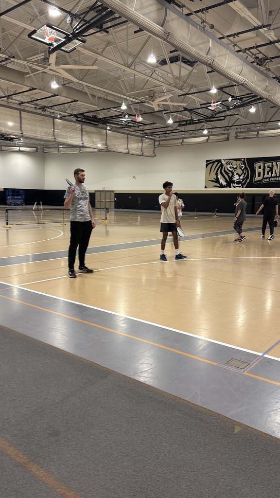 2 men playing pickleball