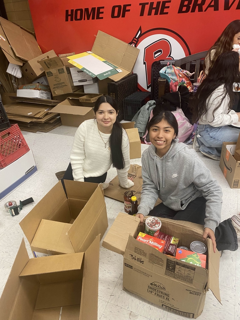 2 Volunteers for Food Drive working