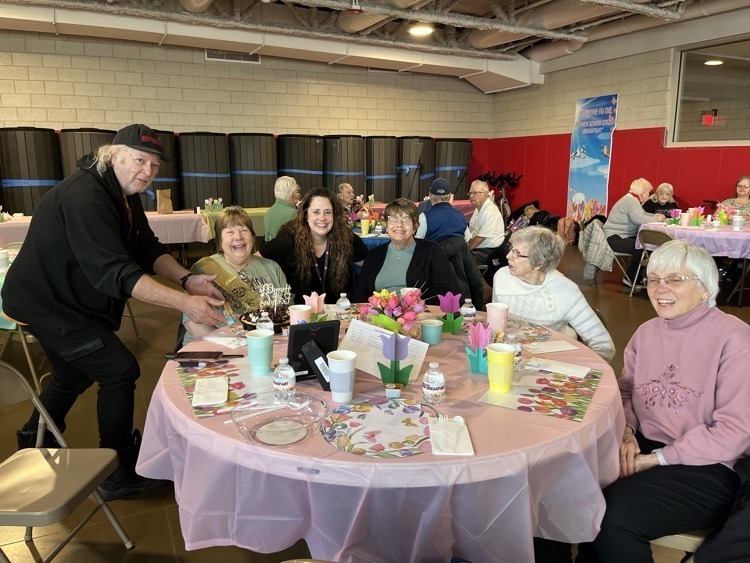 Six guests of our Bremen High School Senior Citizens luncheon sit around a table at Bremen High School. 