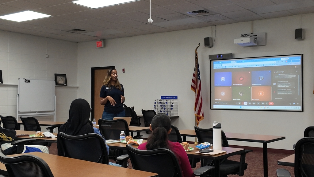  Associate Program Director, Xandria Hair, is pictured below discussing the program and answering questions students have. 