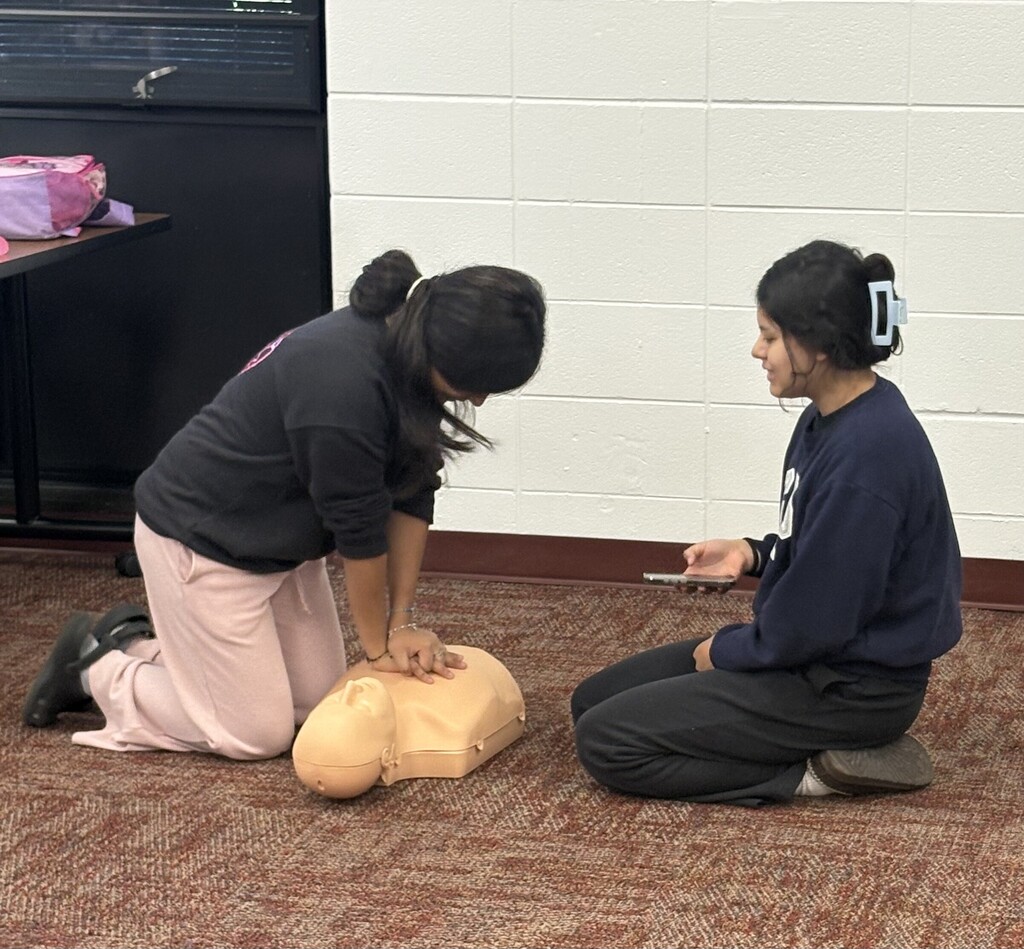 Students in Mrs. Flannigan’s Child Care 2 class practice CPR and First Aid skills during certification training.