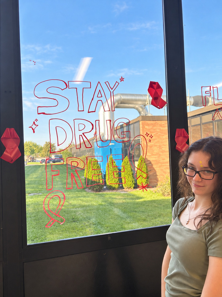 Snowball team members and student volunteers decorate school hallways and windows with positive, encouraging messages for Red Ribbon Week.