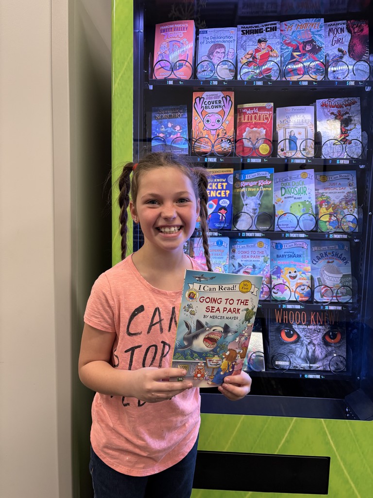 The girl with the book she picked.