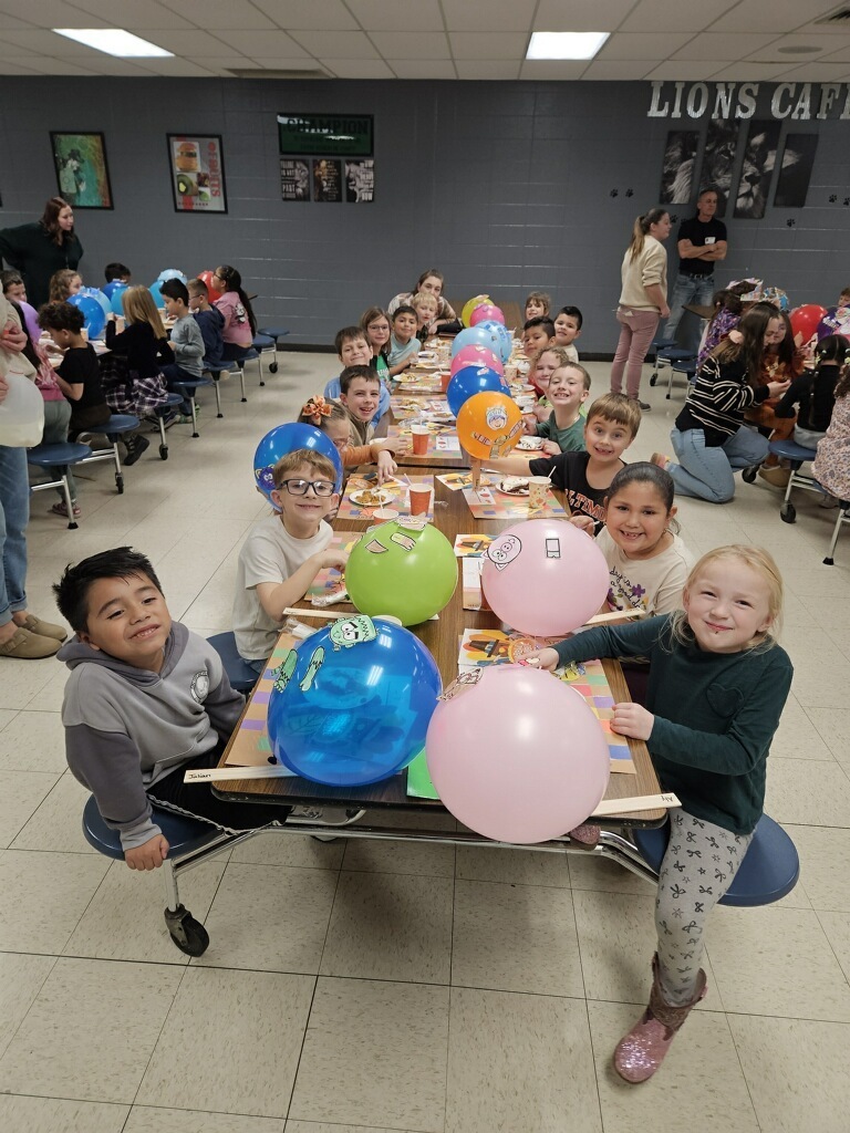 1 st Grade  in the cafeteria with balloons