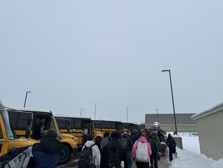 students leaving buses 