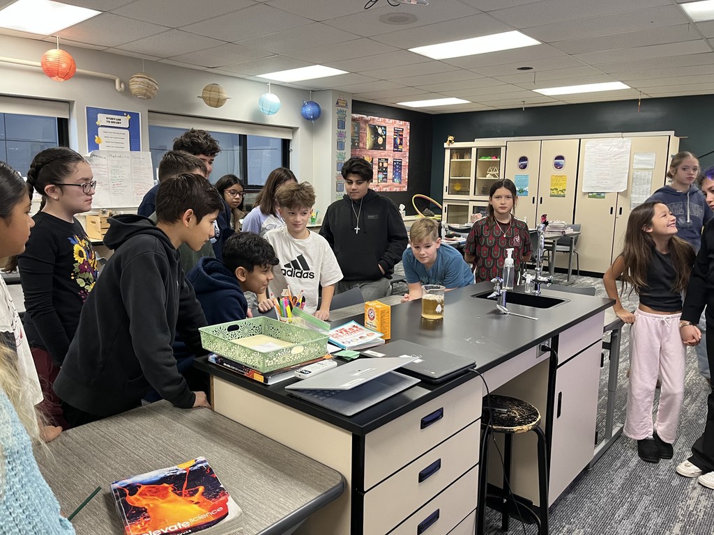 Students watching a science experiment