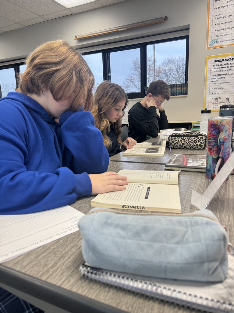 3 students reading books