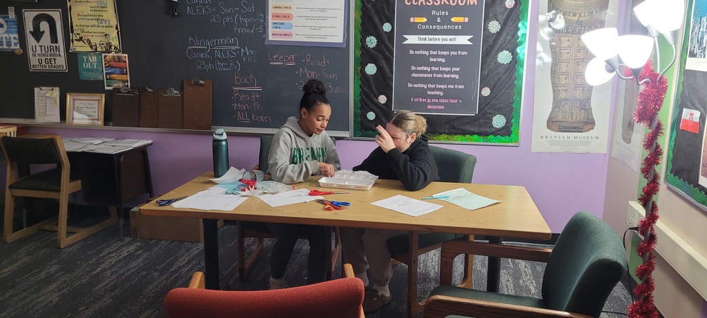 2 girls working at a desk