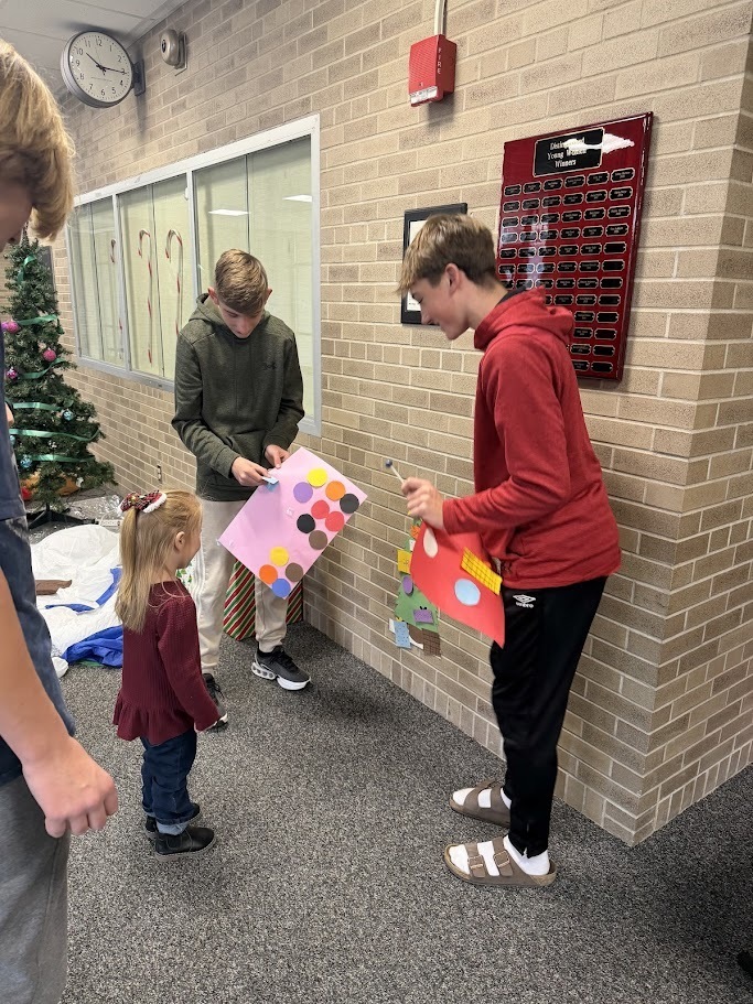 2 boys playing with dot games