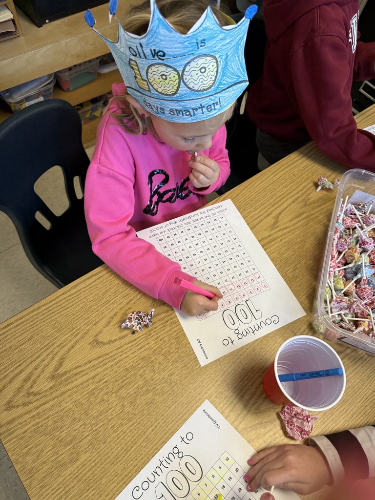 A students wearing a crown counting to 100