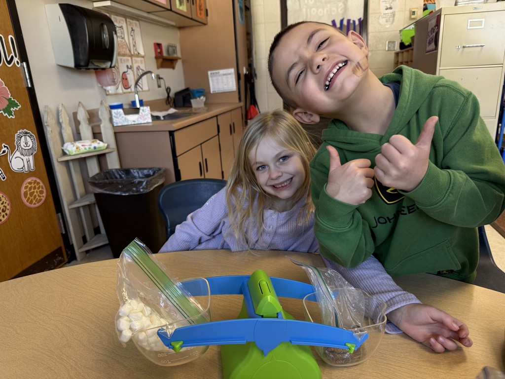 Two students measuring