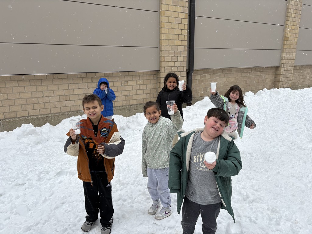6 students outside in the snow