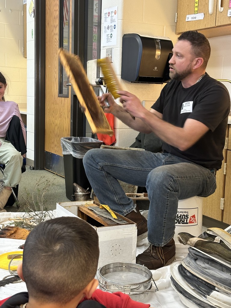 a man showing honey combs