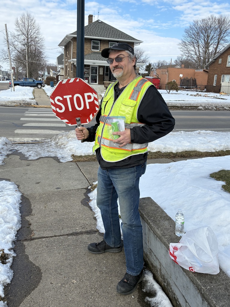 Crossing guard with his stop sign