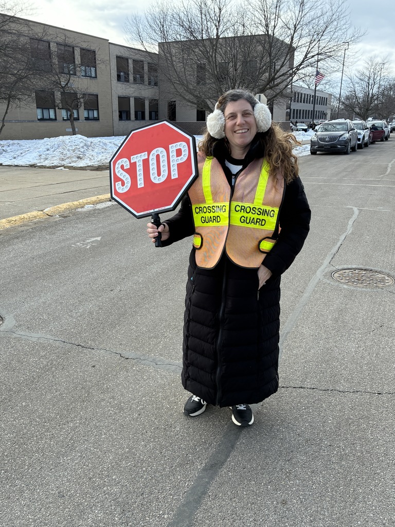 a crossing guard with her sign