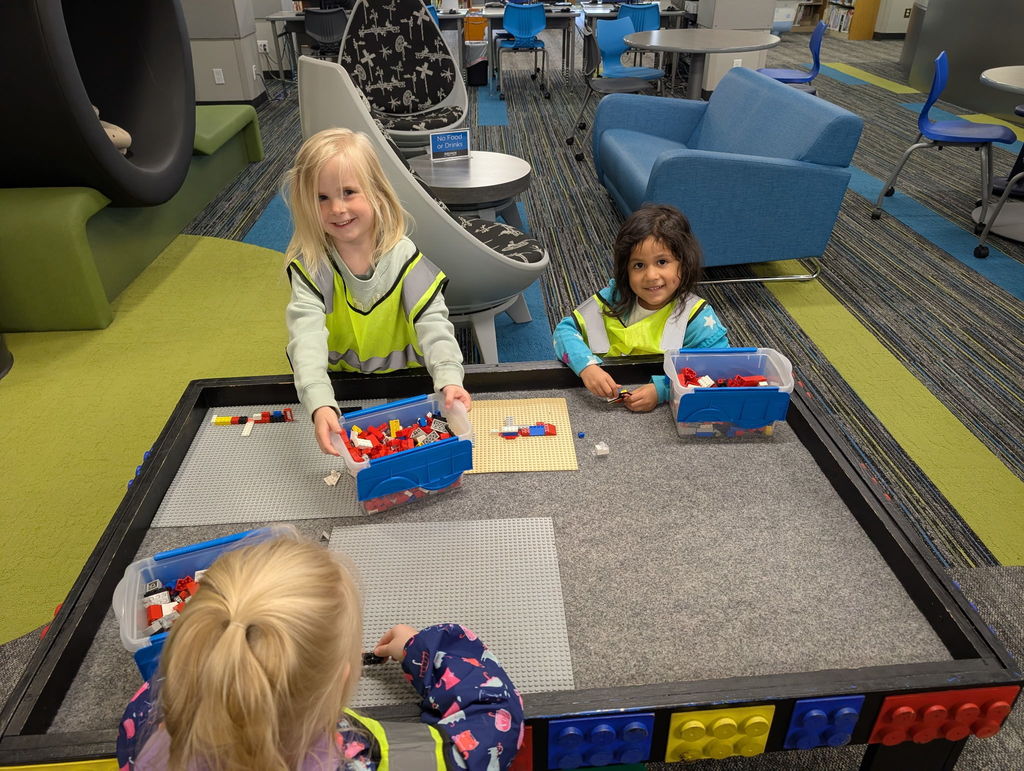 students at lego tables