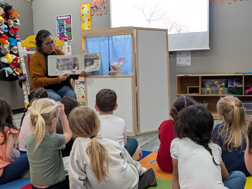 students watching a puppet show