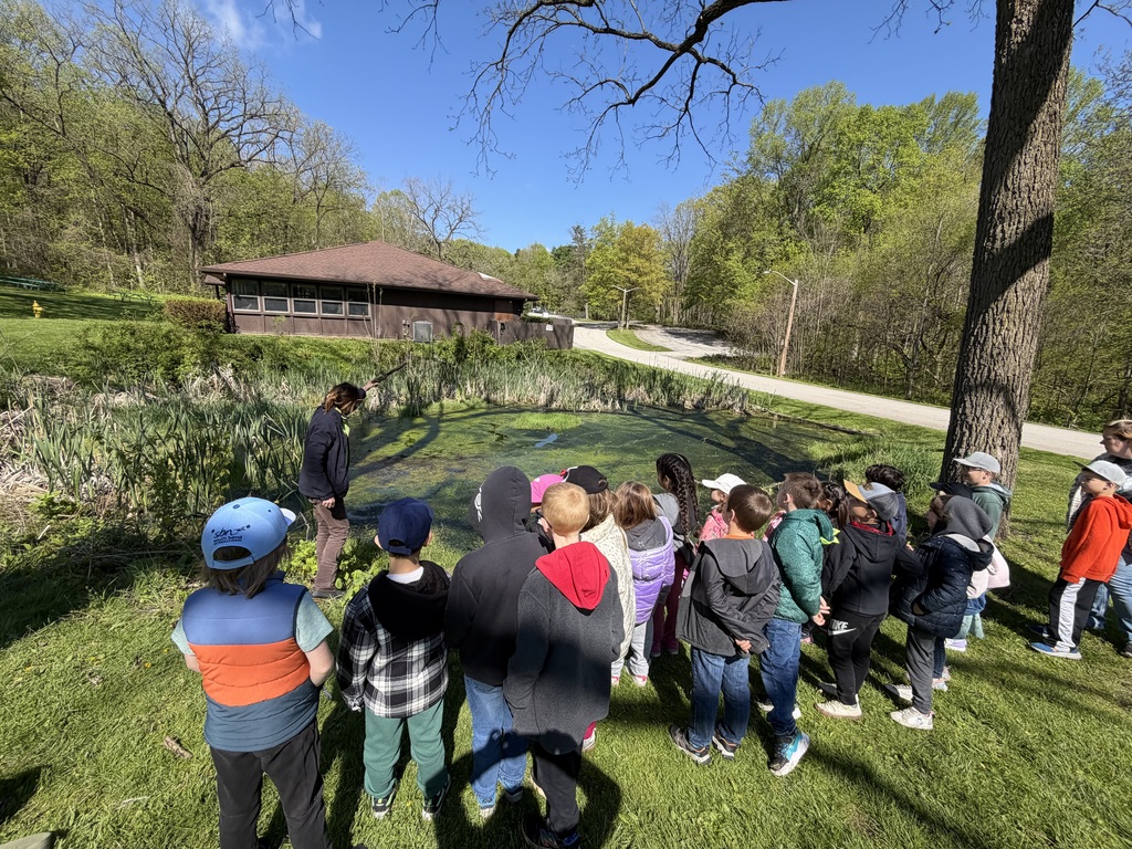 Students outside talking with a guide
