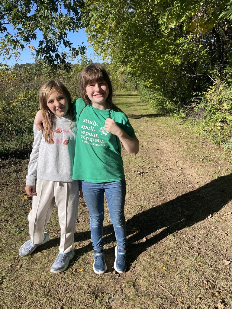 2 students on a trail