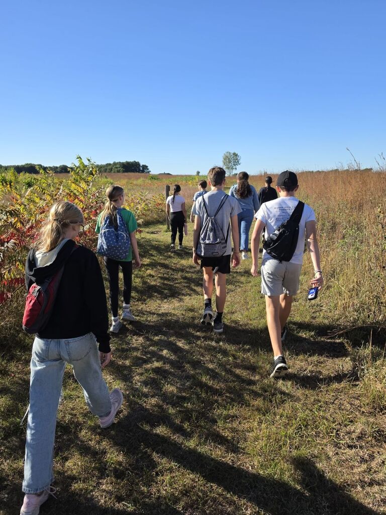 Students walking through a path.