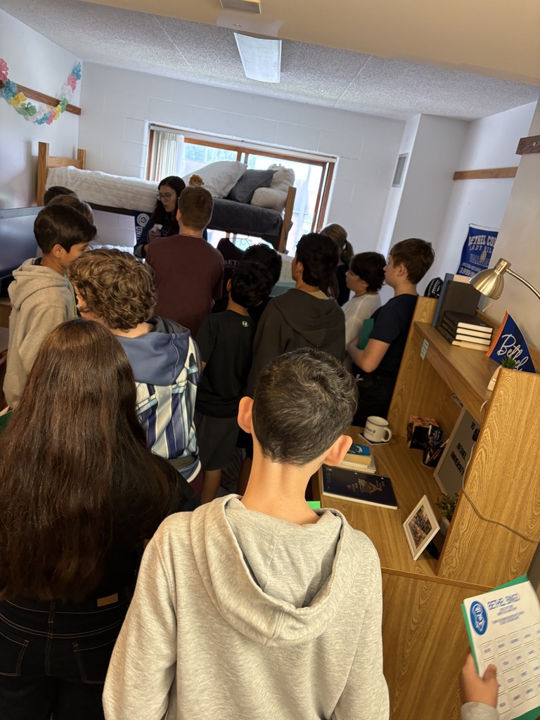 A group of 7th grade students in a dorm room