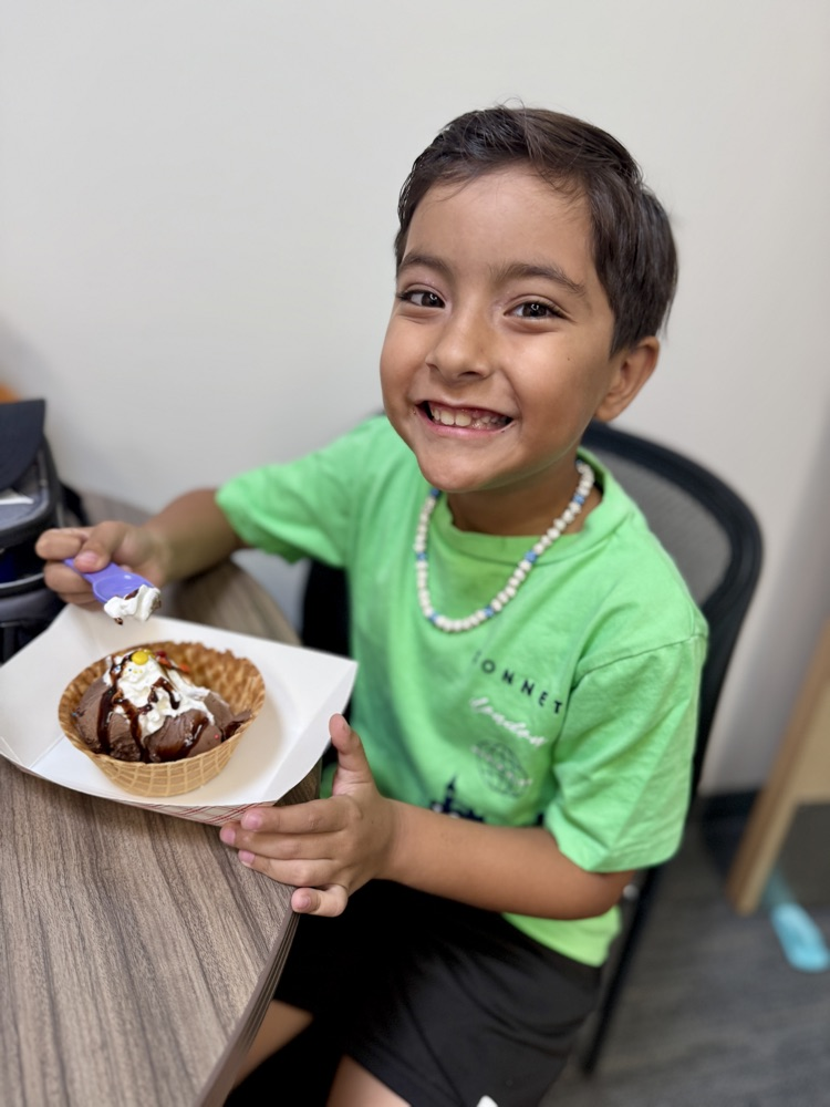 big smiles before diving into a delicious sundae 