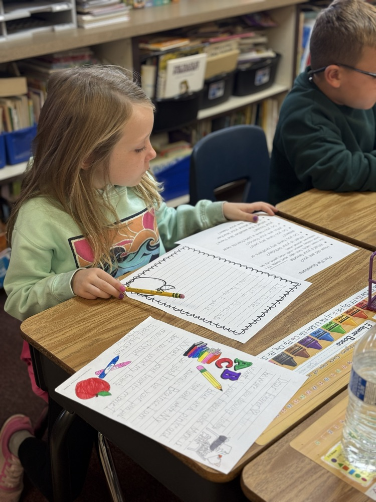 Answering her penpal questions 