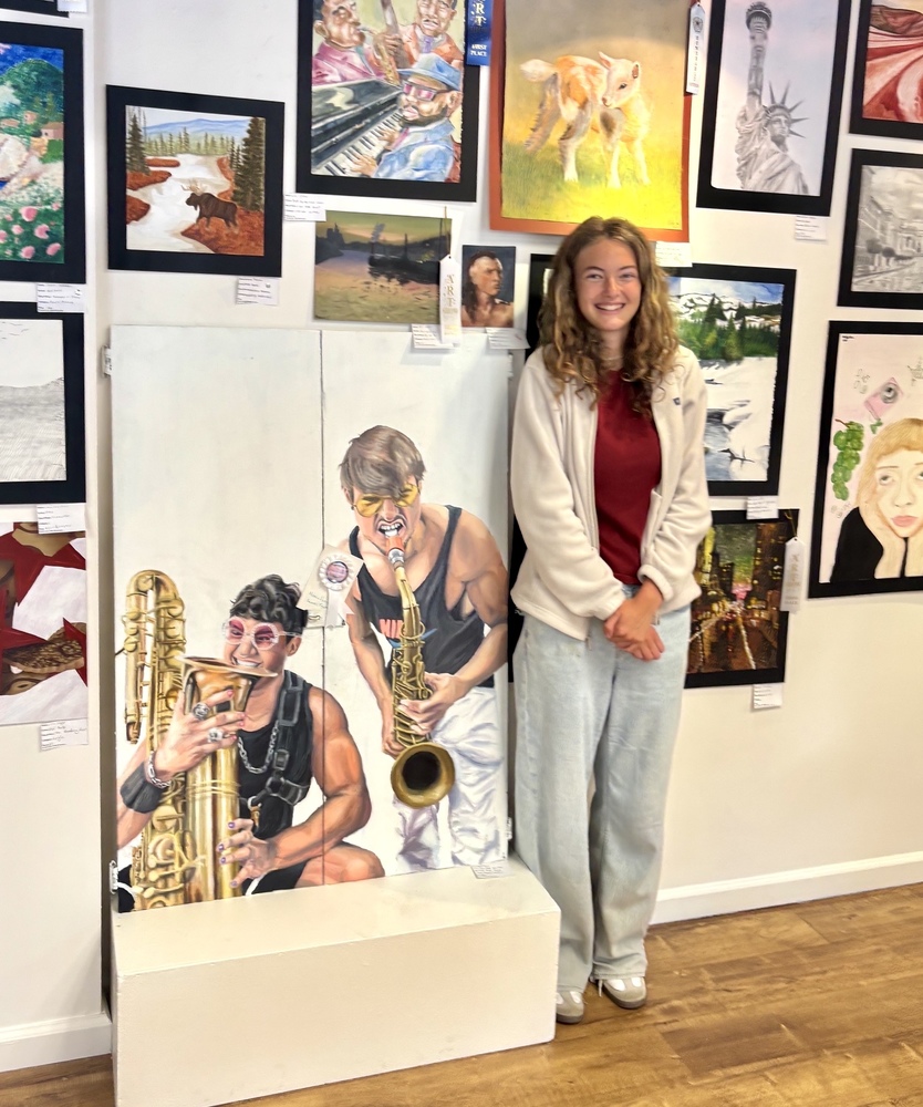 Annie Farris with her paiting, Moon Hooch
