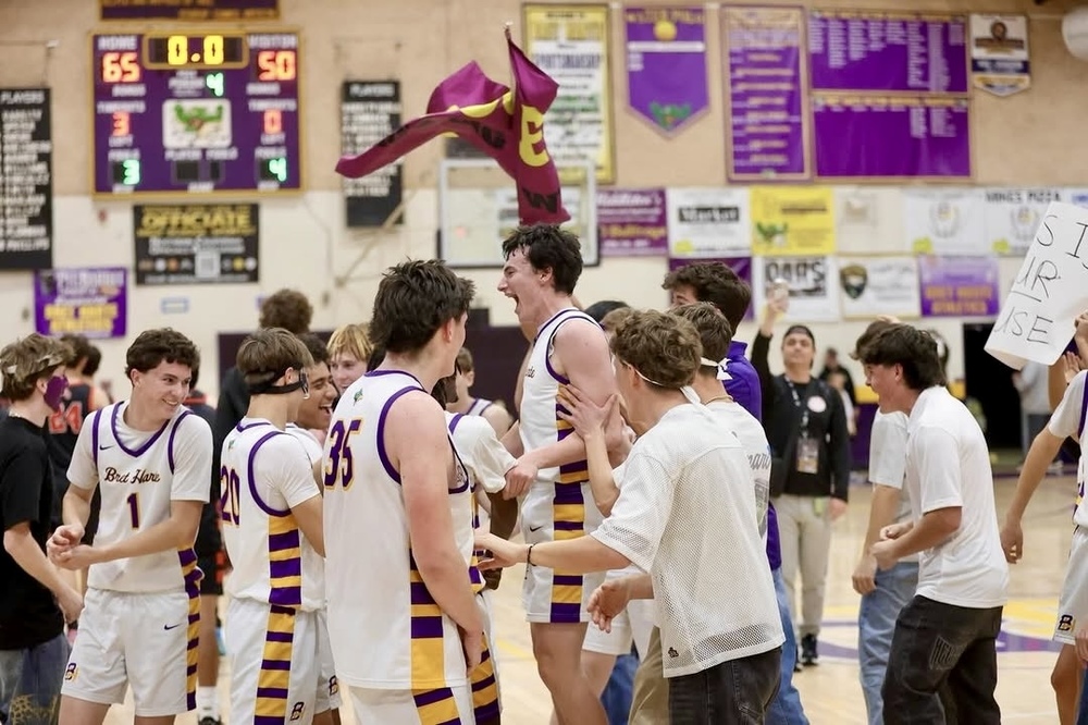 Boys Basketball celebrating semifinals win
