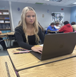 PSAT Preparation: Junior Alma Molander stays focused as she works on her laptop, reflecting the dedication she brings to her studies. In preparation for the PSAT, Alma took the initiative to boost her knowledge outside the classroom. “I watched videos on YouTube to prepare,” Molander said, highlighting her proactive approach to learning. This effort helped her feel more confident and ready when it came time for the test, showing the importance of using resources to enhance understanding. Photo By Chloe Strong