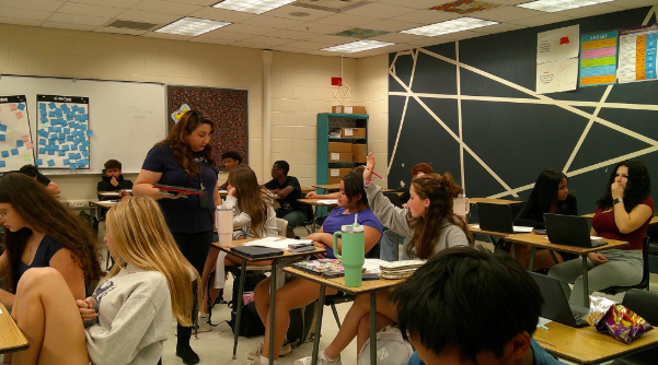 TEACHING TALENT:Ms. Irene Lopez moved around the classroom and actively helped her students understand during her 6th period class. The students had learned about alternate and interior angles in geometry last Thursday, October 2nd. During 6th period, Ms. Lopez used her iPad, connected to the Promethean Board, to walk through the questions the class had missed. She explained how to solve them and called on students to participate. Her teaching style was captured to a T: “A modern approach—technology-oriented, but also showing the work,” stated Ms. Lopez in her interview that morning. Photo by Issy Perez.