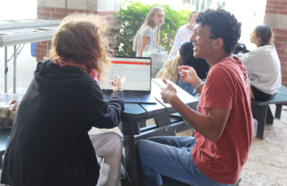 Caption: Choosing the Future Reviewing course options for next year, freshmen select electives before the March 10-12 deadline. Ninth graders Maddy Hill and Joshua Campbell looked through classes and spoke with guidance counselors while planning their schedules. “Electives help me decide what I might want to do in the future,” Hill said. Photo  by Ava Brouard