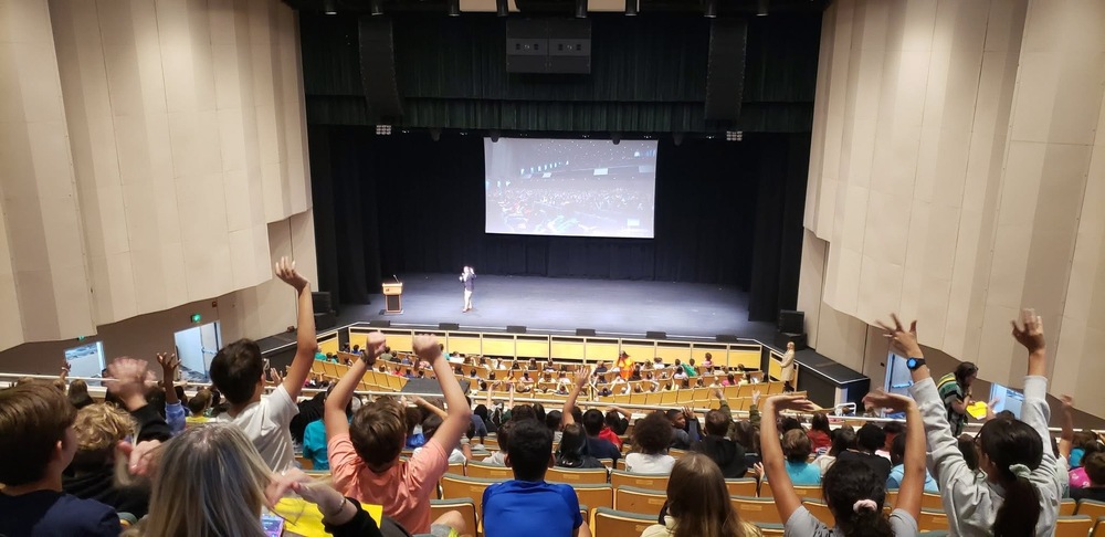Students in auditorium listening to lecture