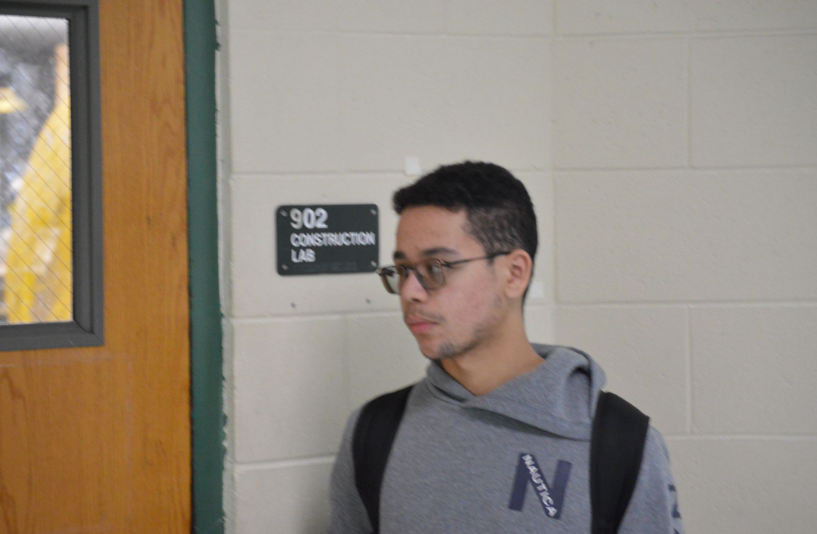 Sending Off for Construction: Matthew Marcano taking one last look at Construction, the previously active course in Building 9. Marcano was a student of both the previous Construction 1 course ran by Mr. Dyer, and the Construction 2 course ran by Mr. Zimmerman. “I hope for the next year, they can bring it back, but for me? I’m done. I got a certificate for apprenticeship, that’s all I need.” said Marcano. Photo by Tyler Ferreira Alves Hill.
