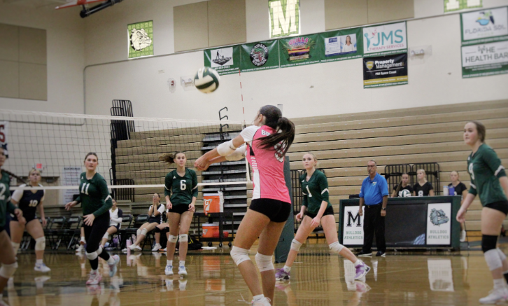 RISE ABOVE. Sophomore captain Lilliana Carter delivers a perfect receive to the setter during a home game against Eau Gallie. Playing libero for the JV team, Carter says, "The team is doing really well and we’re getting along. We’ve been learning how each of us plays individually and using that to function better as a team." Photo by: Brooke Johnson