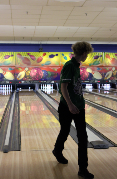 STRIKE SHOT: Freshman CJ Davenport steps up for his final shot of the night; the pins go down—strike! The Bulldogs Bowling team clinched a thrilling victory over the Eau Gallie Commodores at Shorelanes. With smiles all around, the team celebrated being one step closer to the championships. The game took place on Tuesday, September 23rd— a night packed with hope for the upcoming games. “No, I don’t think I’ve been on a better team. I think we have a chance,” Davenport says. Photo by Issy Perez.