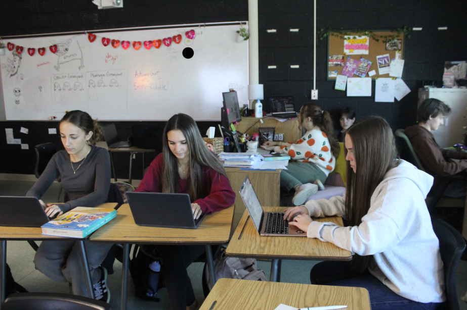 Behind the Scenes: A student podcast team works together to plan and record an episode at school. The podcast team included Madison Maringola and Anastasia Mijatovic in Ms. Anderson's 4th period creative writing class. The students worked together and researched the science behind Needohs, planned scripts, and record their episodes on the computer. Maringola said, “The most challenging part of making the podcast was memorizing and remembering our script.” Photo by Ayaana Gupta  