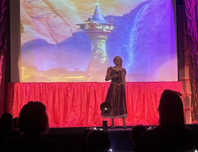 Evyn Vandegrift who plays Rapunzel in Enchanted Tea Party at Melbourne High School performing on showday. “Being able to play my favorite character has been so much fun.”  Photo by Braelyn Arenella-White.