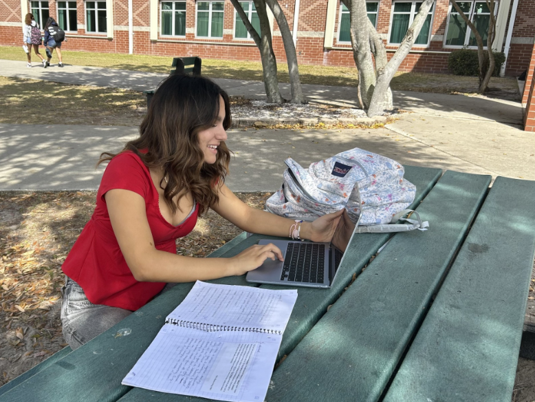 Keeping the Class Alive: Sophomore Juliette Contreras looks through Melbourne High’s course offerings to plan her junior year schedule. “For specialty programs, if the teacher left, the program may die or feel different, especially if a teacher has been teaching it for a while,” said Contreras. In previous years, courses such as TV Production and Fashion were offered, but as student interests and staffing needs fluctuated, these programs were absorbed into existing classes, or removed from course offerings. Photo by Kyle McLaren