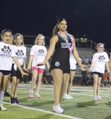 A dancing Miracle: Freshman Aliana Alvarado a member of the miracle dance team performs hip-hop dance with ponytail dance club at melbourne high school. Alvarado's team and the ponytail dancers shine as they perform, the ponytail dancers look so happy to be dancing with the Miracle dance team, as if they look up to them. “The ponytail dance club was so excited to perform the hip-hop dance with us” Alvarado says. Photo credits: Caroline Schneider