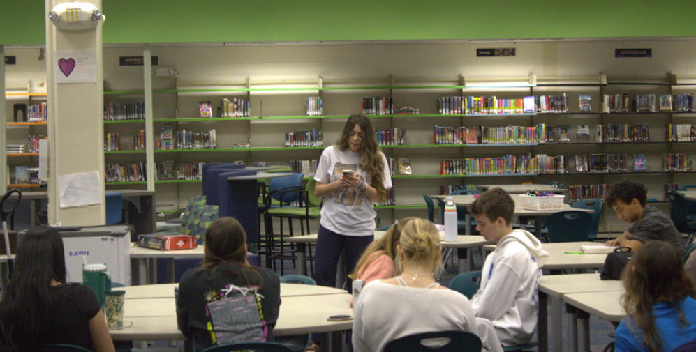 Focused Faith: First Priority is giving students opportunities to exercise their faith in front of other students. As well as time for fellowship. Students here at Melbourne High School are surrounded by secular belief systems and people. But First Priority has opened the way for Christians to partake in a kind of youth group. Mrs. Carrie Friday, the librarian and sponsor of First Priority has said “... the students are amazing…” and “...First Priority is an important part of the week for these students…”. Students come to pray, listen, and learn, as well as to simply spend time with one another in the name of the Lord. Photo By: Aiden Kehayias