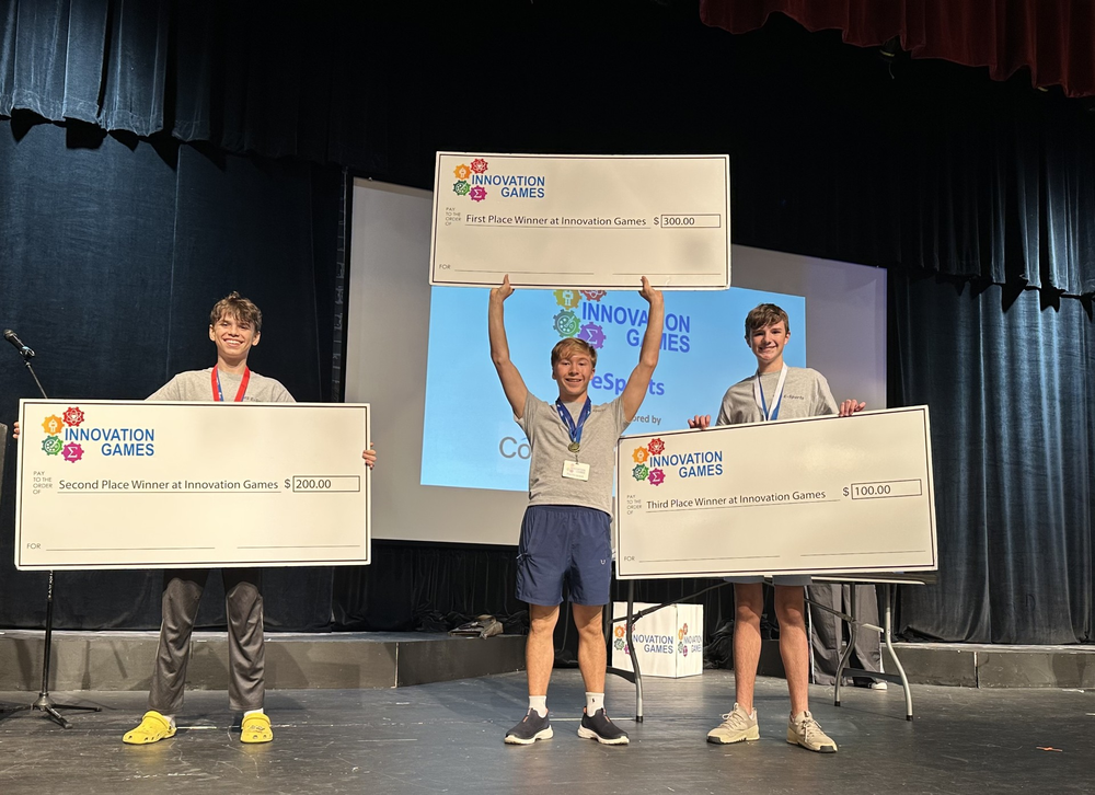 Students holding Checks