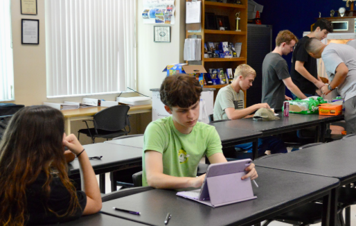 Leadership In Action. Cadets stock the ROTC fridge together during B Lunch. These small acts demonstrated how the program encouraged students to care for others and step up in meaningful ways. Everyday, cadets sat in the ROTC room and did homework, or simply had lunch with their friends. Every day, they reminded everyone that leadership wasn’t just about rank—it was about action and heart, as Chief Master Sergeant Jay Blackwell said, “Their commitment to something they absolutely didn't have to do, but they did. Every day, seeing you all come in with that attitude inspired me to be a better person.” Photo by Aadhya Patel.