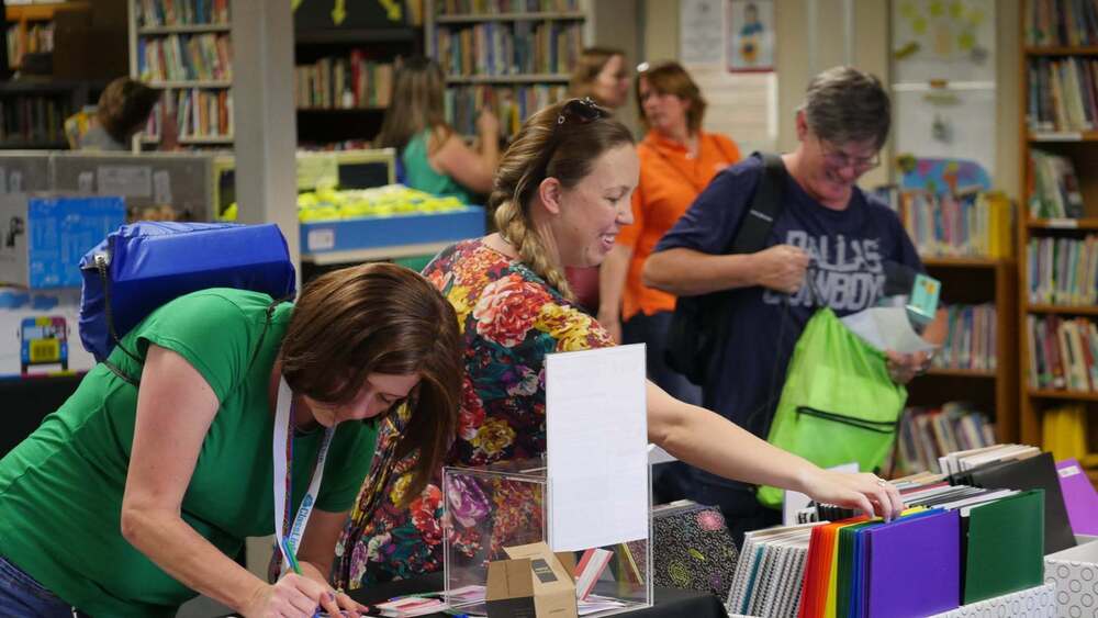 Teachers collecting free school supplies