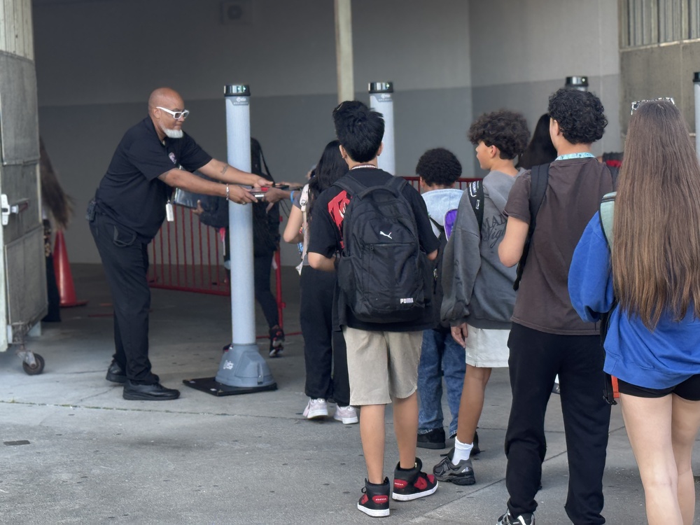 Middle schools students walking through new open gate system