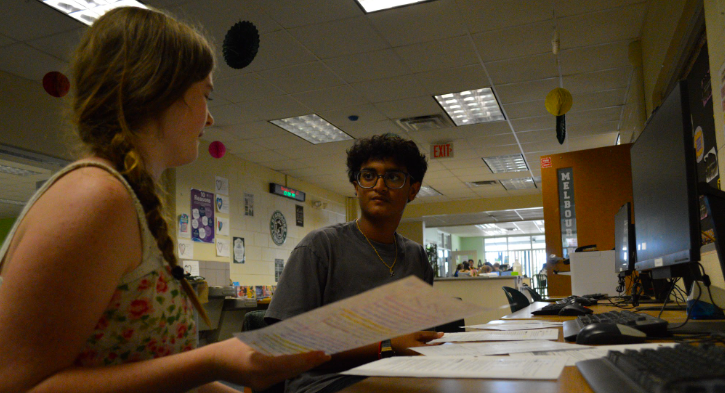 FRESHMAN PRESIDENCY. Ella Madeline Nicholson Morrissey and Kush Chovatia discuss ideas while reviewing papers. The Class of 2029 recently elected Morrissey and Chovatia as their President and Vice President, marking their first leadership roles in high school. Even informal discussions like these help them prepare to represent their classmates and plan events, like homecoming, for example, which is fast approaching and the student council has a lot of planning to do. When asked what the biggest help would be from their classmates and the rest of the student council, Morrissey says, “I just want to hear everyone’s input on what they want.” Their goal for the year is simple: listen, collaborate and make all events, big or small, meaningful for everyone. Photo by Aadhya Patel.