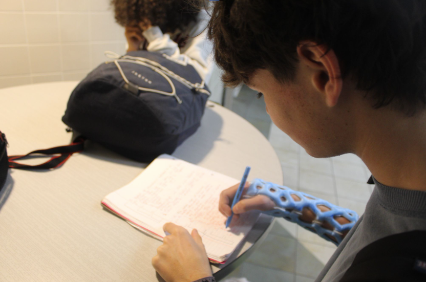 Royce Walden, a freshman, utilizes his lunch period to study for an upcoming history exam, attempting to manage the little time lunch gives you. Royce juggles soccer and school and it can get stressful when he doesn't have enough time after practice to finish homework. “It can get stressful but I always manage to get my work done,” he said. Photo by: Matthew Trazzeraw